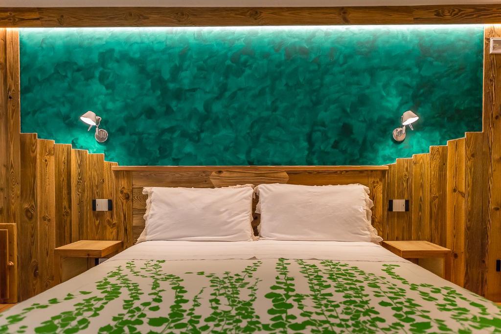 Postel nebo postele na pokoji v ubytování Le Moulin Des Aravis