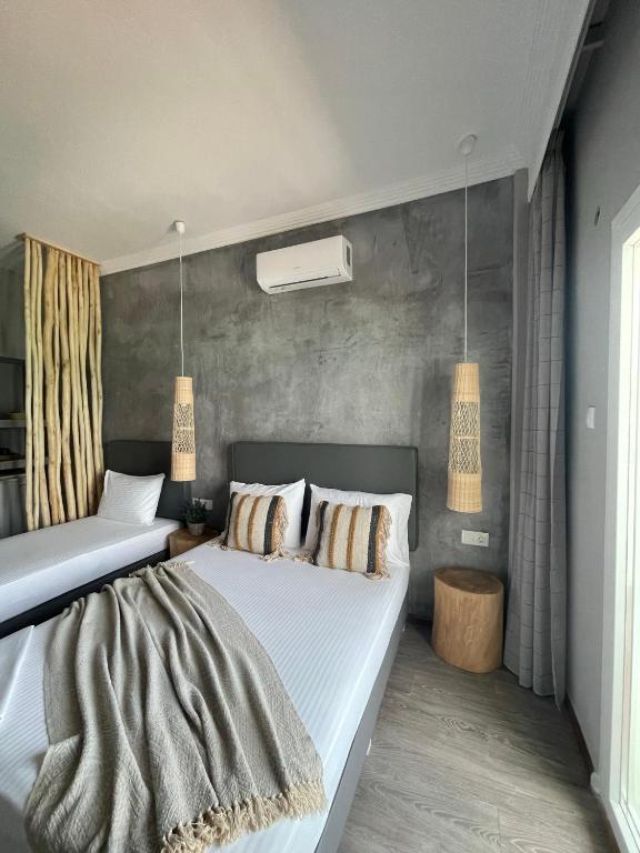 Postel nebo postele na pokoji v ubytování Xenios Hotel