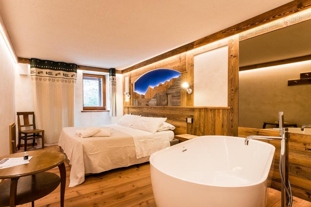 Postel nebo postele na pokoji v ubytování Le Moulin Des Aravis