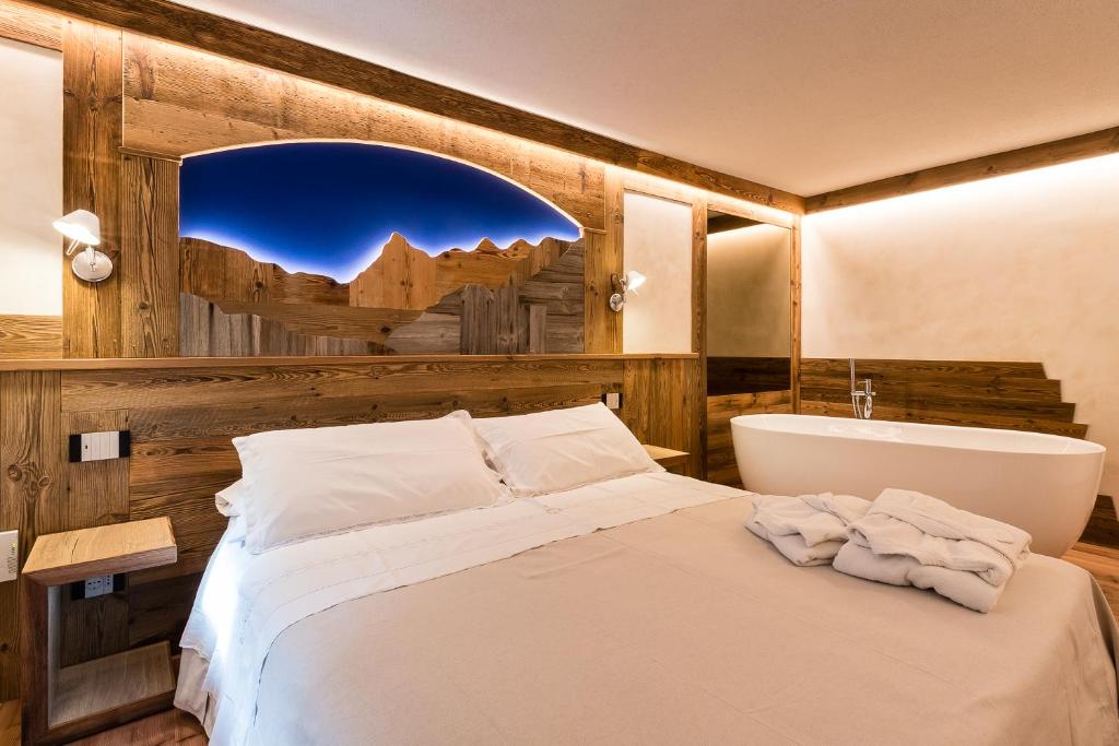 Postel nebo postele na pokoji v ubytování Le Moulin Des Aravis