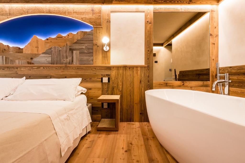 Postel nebo postele na pokoji v ubytování Le Moulin Des Aravis