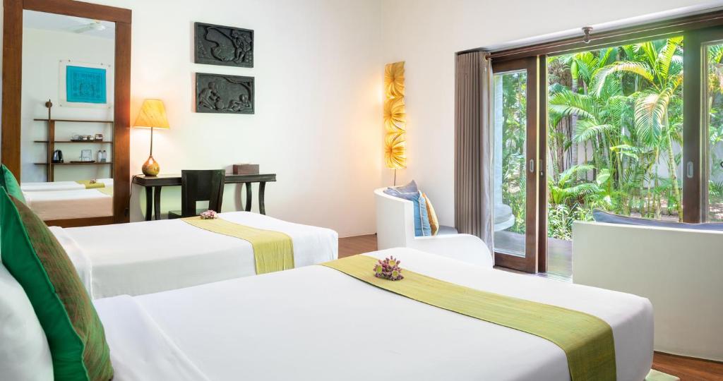 Postel nebo postele na pokoji v ubytování Navutu Dreams Resort & Wellness Retreat