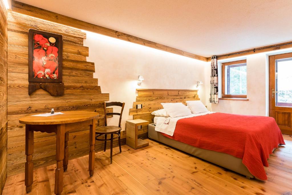 Postel nebo postele na pokoji v ubytování Le Moulin Des Aravis