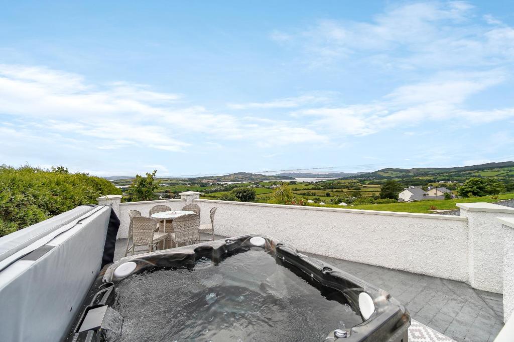 a hot tub on the roof of a house at Seaview Lodge Apartment 'Sleeping 4 Guests' in Tieveborne