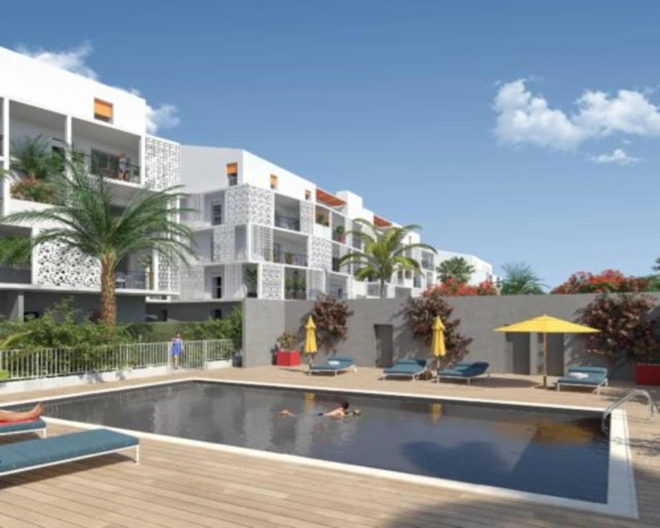 a rendering of a hotel with a swimming pool at Air-conditioned flat with terrace garage and close to beaches in Cannes