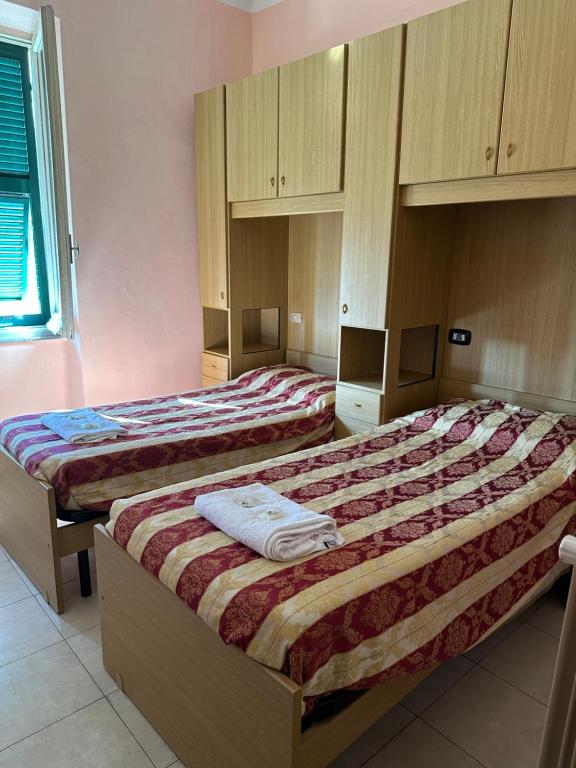 Postel nebo postele na pokoji v ubytování Hotel Aurora