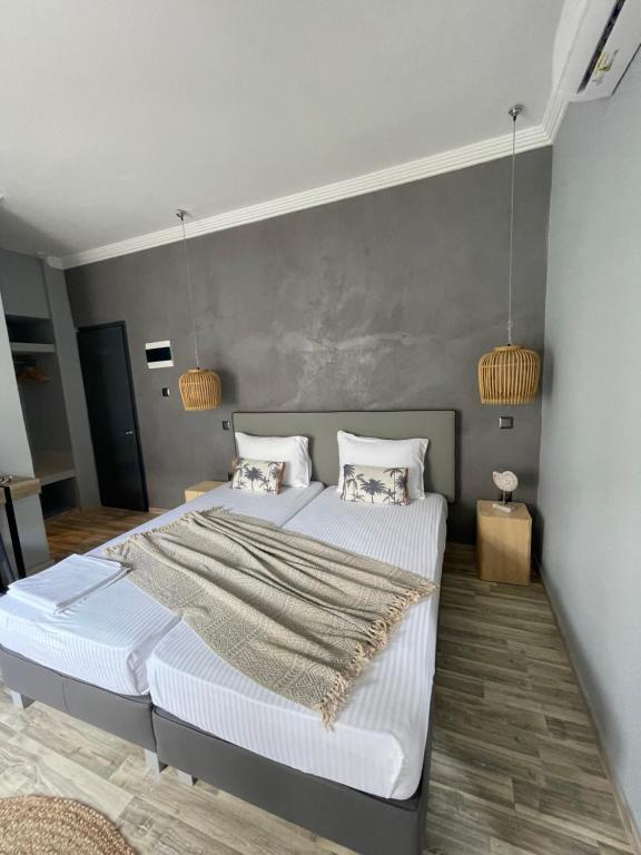 Postel nebo postele na pokoji v ubytování Xenios Hotel