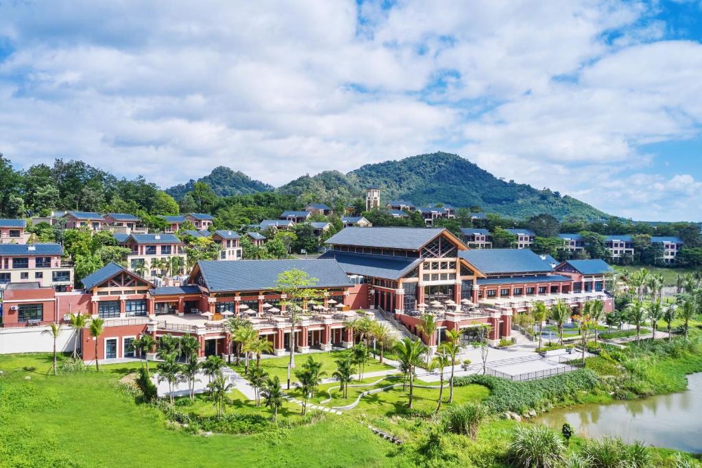 an aerial view of a resort with mountains in the background at Four Points by Sheraton Hainan, Qiongzhong in Qiongzhong