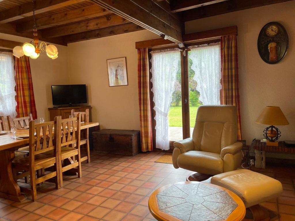 a living room with a table and a chair at Chalet Samoëns, 4 pièces, 5 personnes - FR-1-624-67 in Samoëns