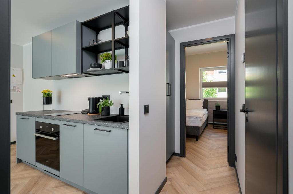Kuchyň nebo kuchyňský kout v ubytování Rare Apartments - Self Check-In Miniapartments