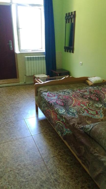 Postel nebo postele na pokoji v ubytování Sevan Garden Complex