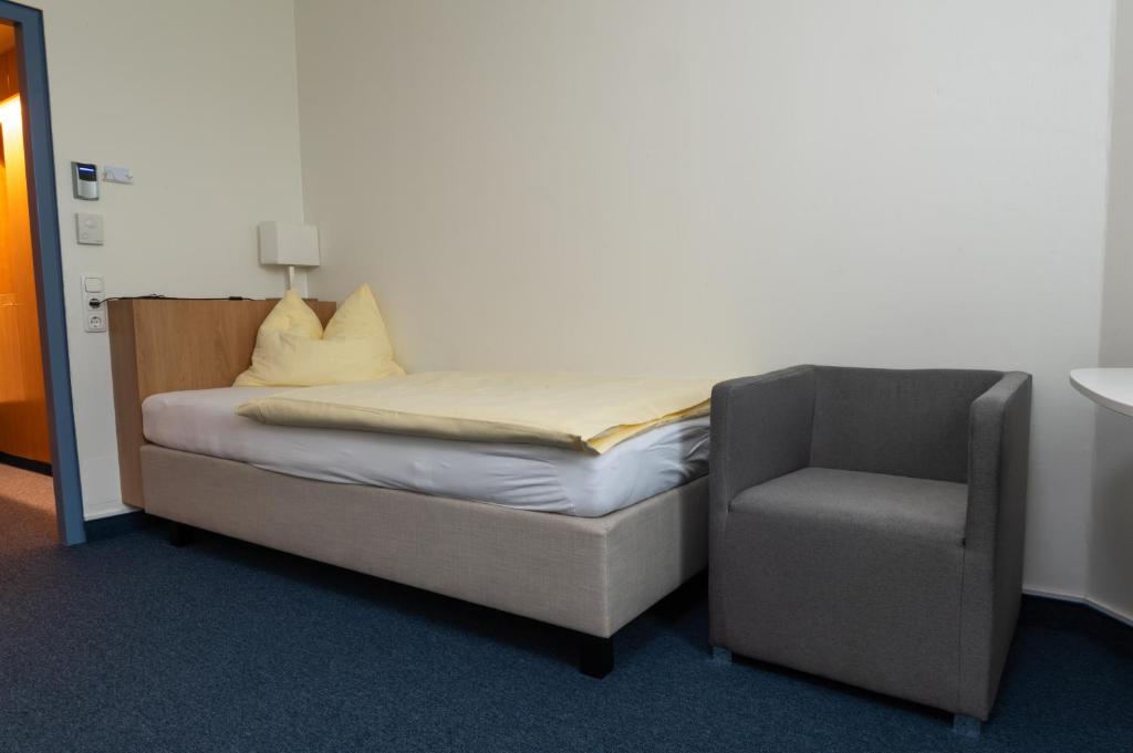 Postel nebo postele na pokoji v ubytování Hotel Sommerhaus Linz