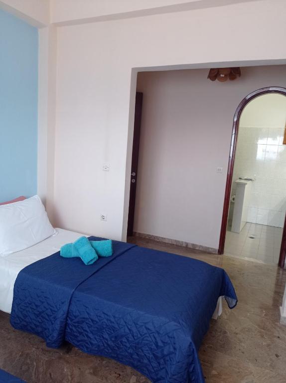 Postel nebo postele na pokoji v ubytování LITHERI-Studios&Apartment