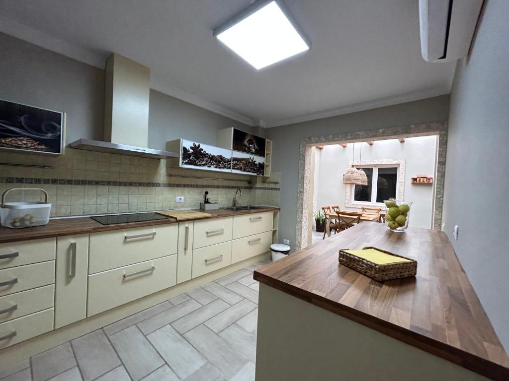 a kitchen with white cabinets and a skylight at Casa Daniella Vivienda A in Ingenio