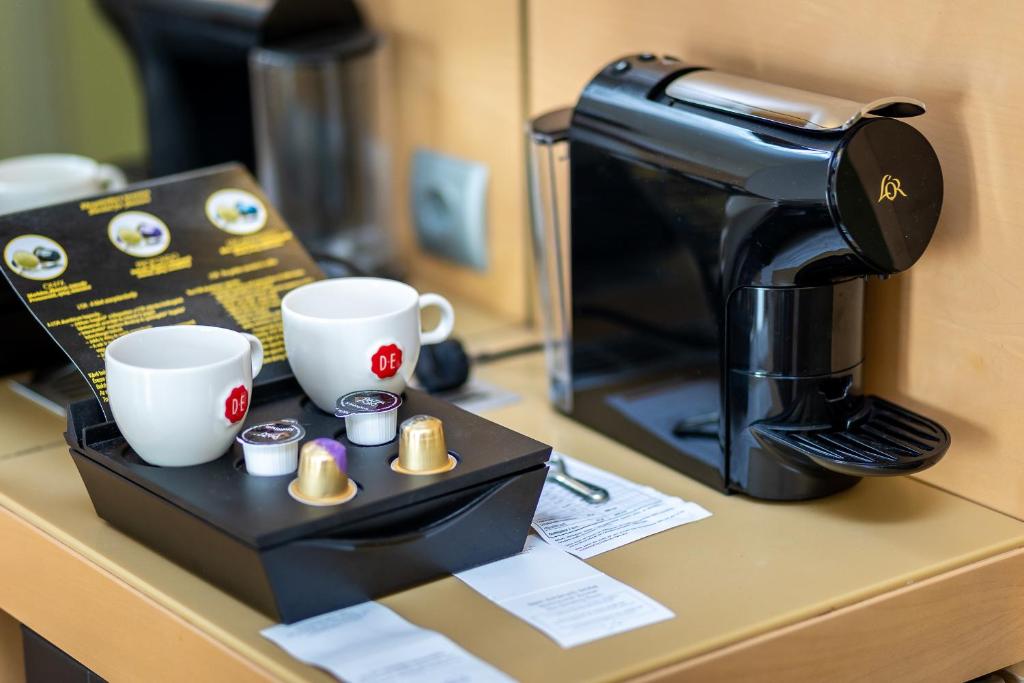 Příslušenství pro přípravu čaje a kávy v ubytování Hotel Sopron