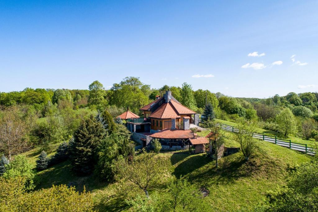 an aerial view of a house in the woods at Hunting Lodge - Happy Rentals in Ribnjačka