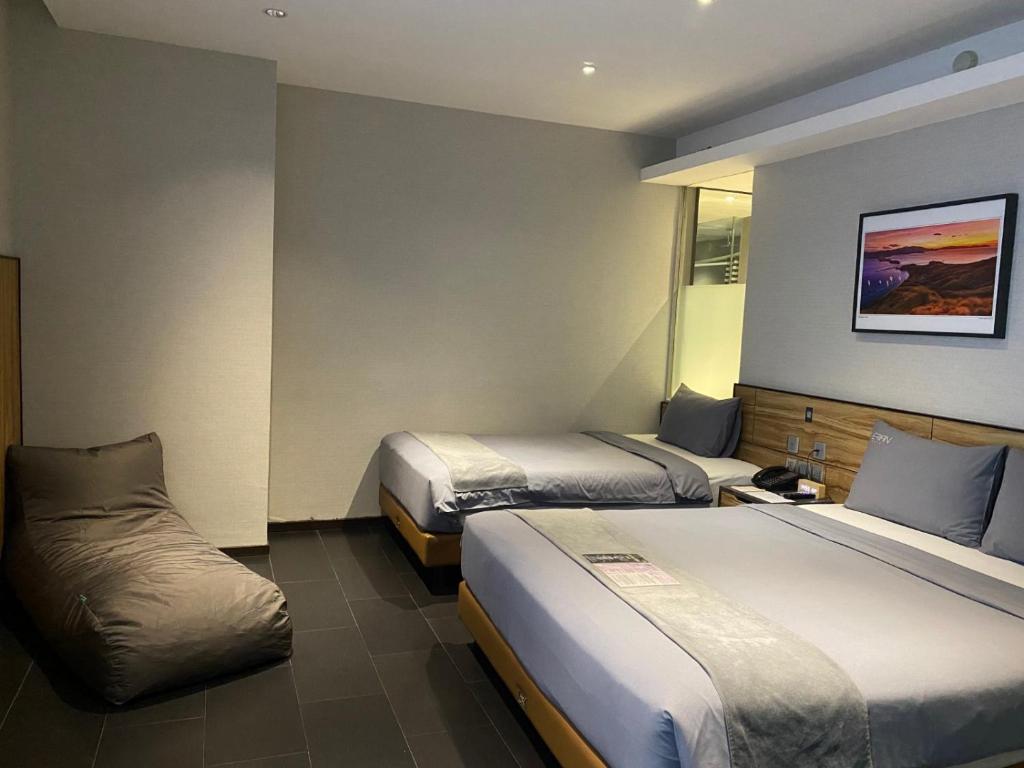 Postel nebo postele na pokoji v ubytování Erian Hotel