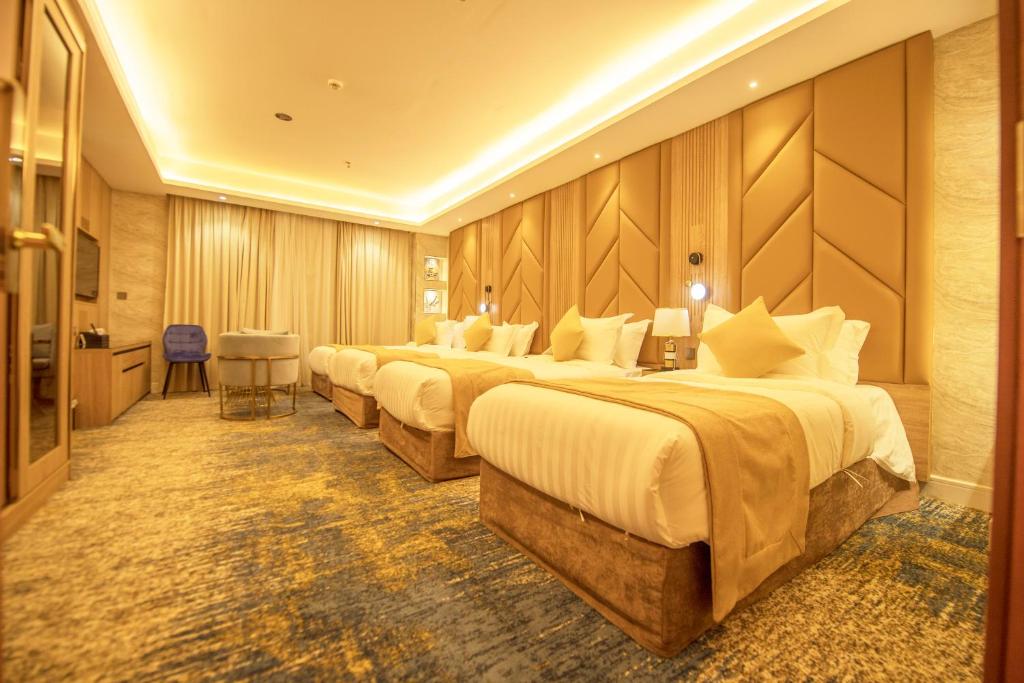 Postel nebo postele na pokoji v ubytování Sparrow Apartments Hotel