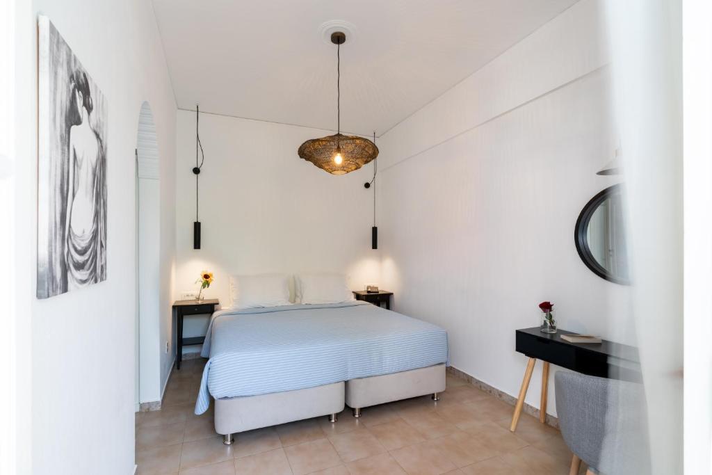 Een bed of bedden in een kamer bij Hotel Matina