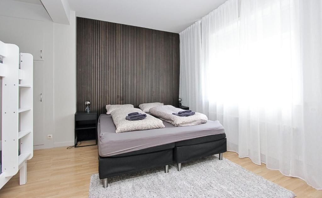 Postel nebo postele na pokoji v ubytování Downtown apartments