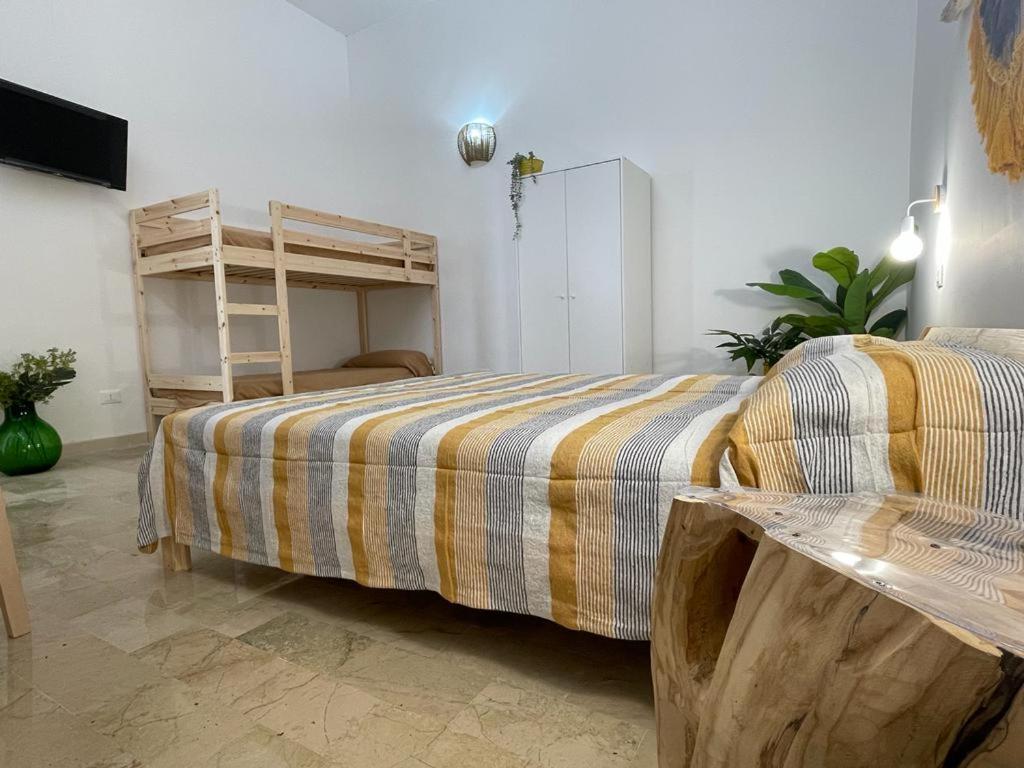 Säng eller sängar i ett rum på Terra De Mare