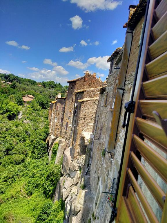 a row of old stone buildings on a hill at Il Loft nel Borgo Sospeso "con vista panoramica" in Vitorchiano