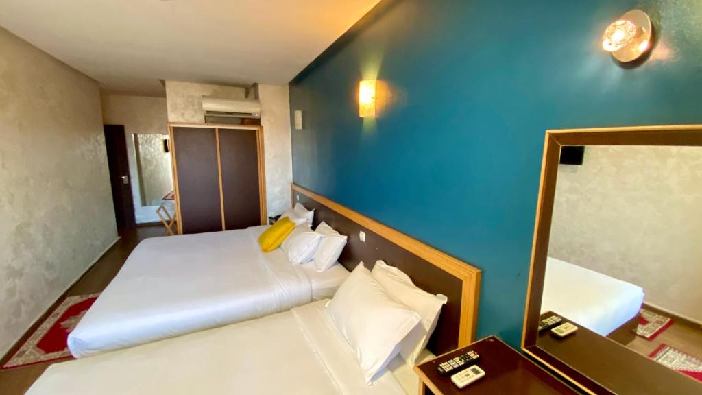 Postel nebo postele na pokoji v ubytování Hôtel Belle Vue et Spa