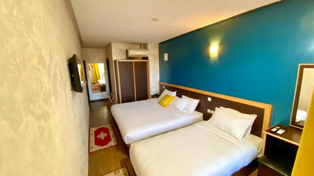 Postel nebo postele na pokoji v ubytování Hôtel Belle Vue et Spa