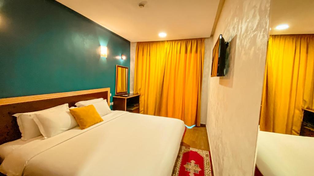Postel nebo postele na pokoji v ubytování Hôtel Belle Vue et Spa