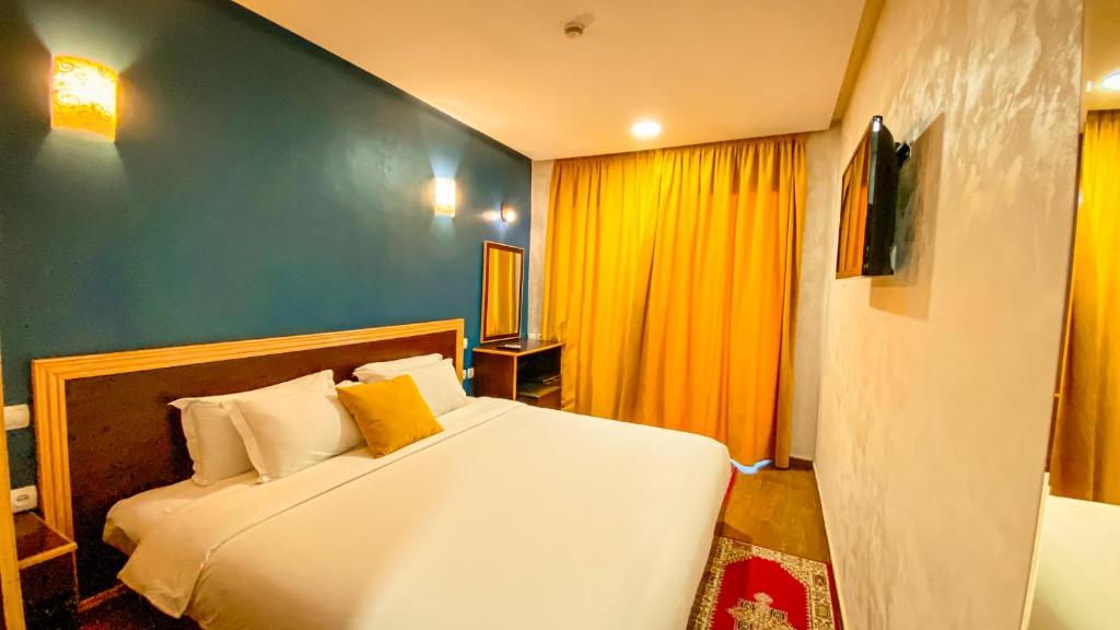 Postel nebo postele na pokoji v ubytování Hôtel Belle Vue et Spa
