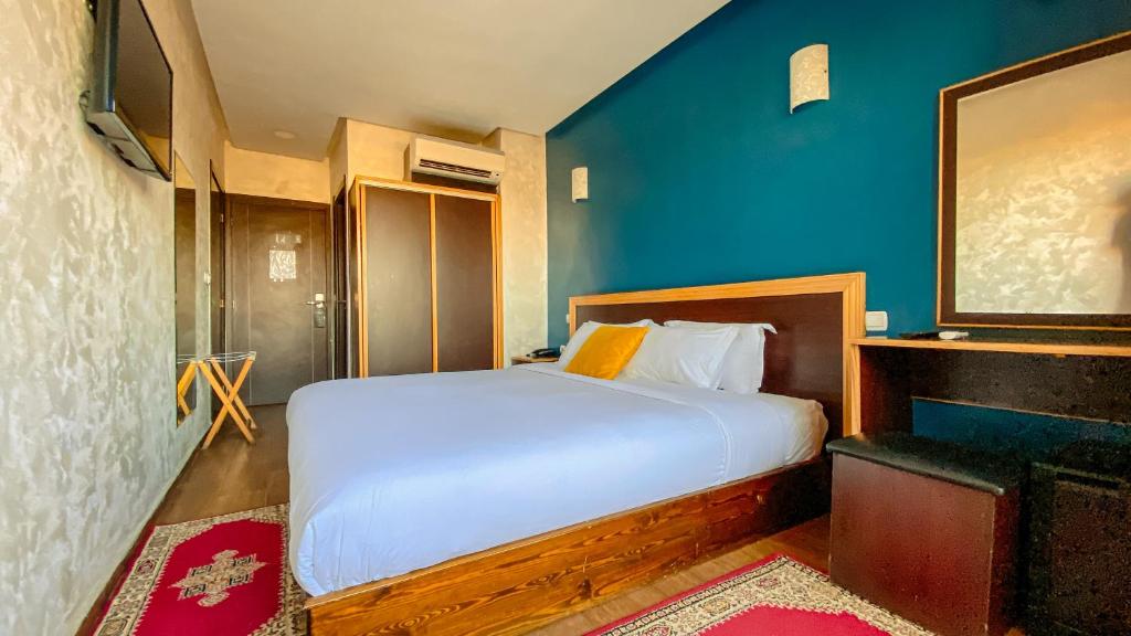 Postel nebo postele na pokoji v ubytování Hôtel Belle Vue et Spa