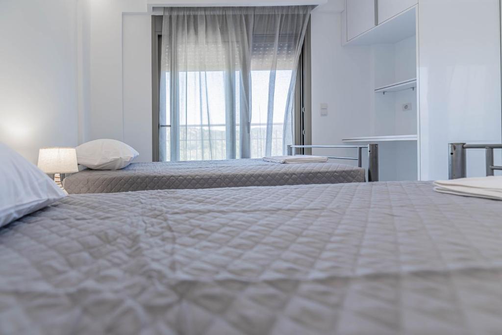 Postel nebo postele na pokoji v ubytování Demiani House