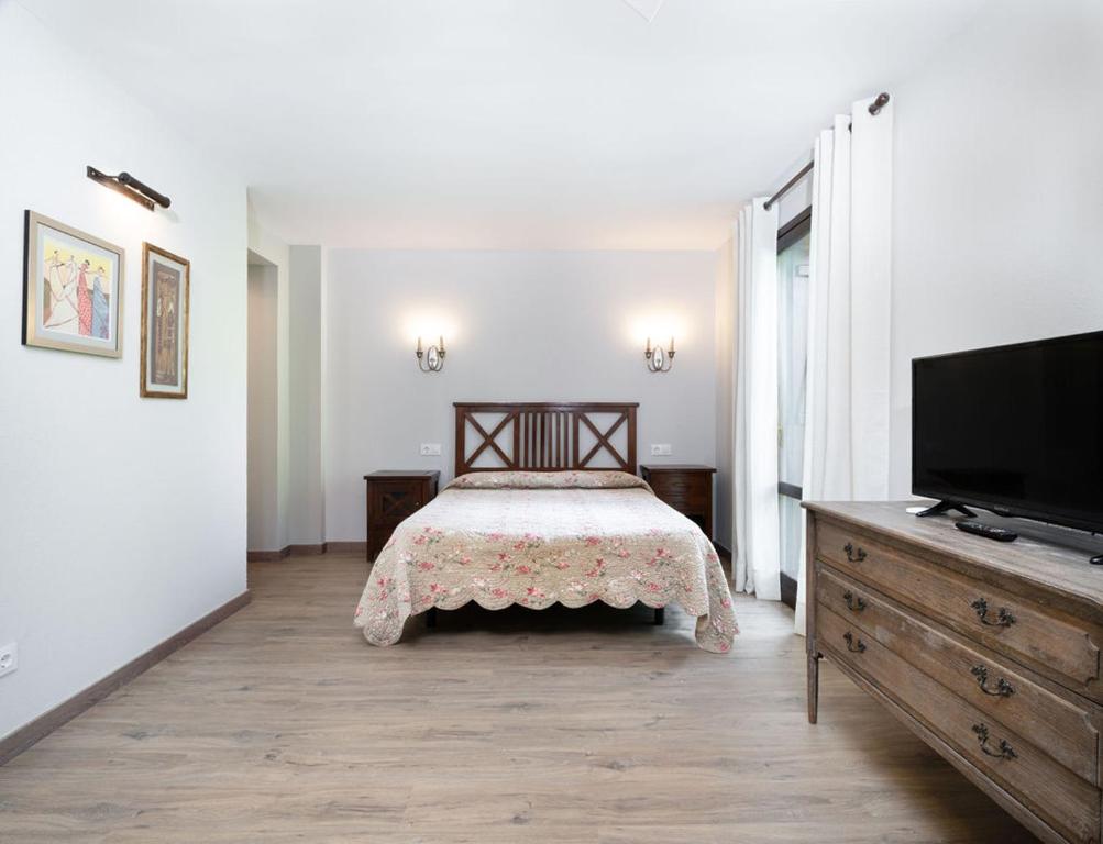 Postel nebo postele na pokoji v ubytování Apartamentos Viña Olivan