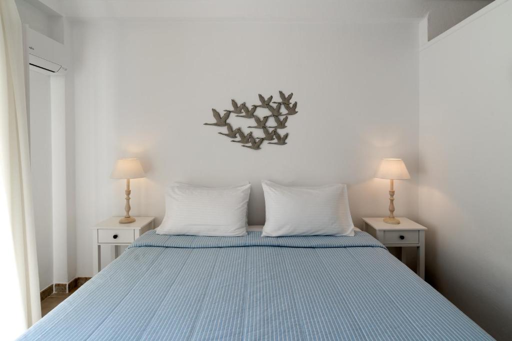 Een bed of bedden in een kamer bij Hotel Matina