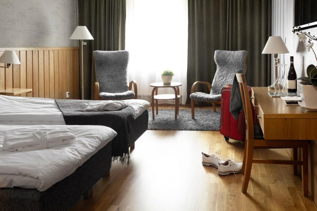 Postel nebo postele na pokoji v ubytování Lannalodge