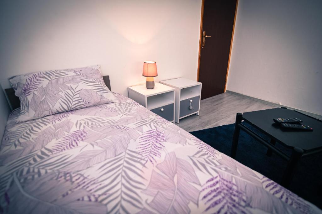 Postel nebo postele na pokoji v ubytování Marko Polo Apartment