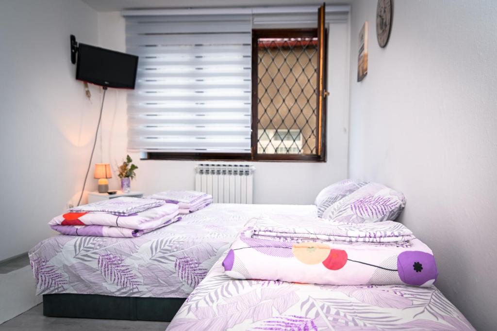Postel nebo postele na pokoji v ubytování Marko Polo Apartment