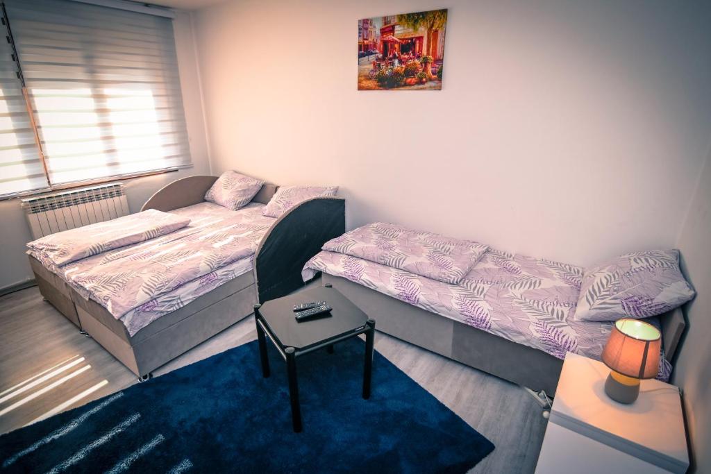 Postel nebo postele na pokoji v ubytování Marko Polo Apartment