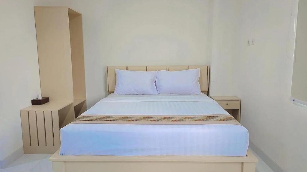 Postel nebo postele na pokoji v ubytování Batik Oma House