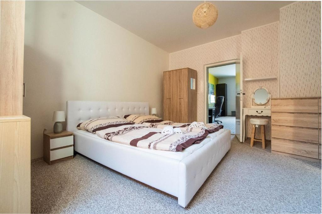 Postel nebo postele na pokoji v ubytování Hotel Pod Zámkem