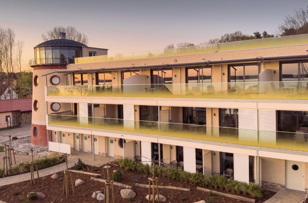 a building with a observatory on top of it at Appartements "Zum Leuchtturm" Hafen Rankwitz Insel Usedom in Rankwitz