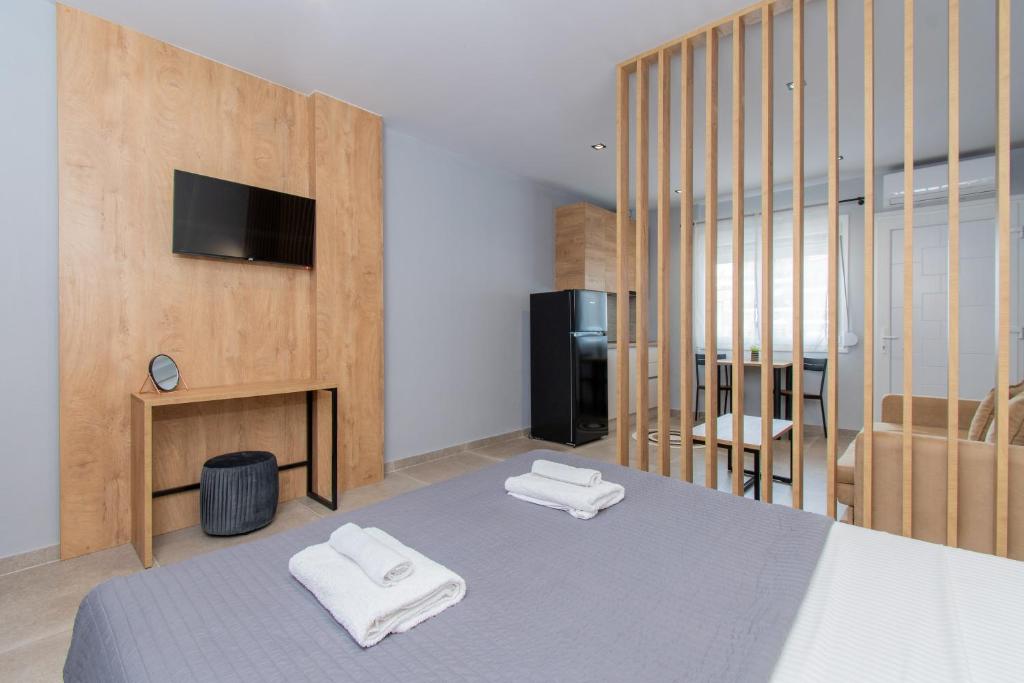 Łóżko lub łóżka w pokoju w obiekcie Unique Aura Luxury Studios