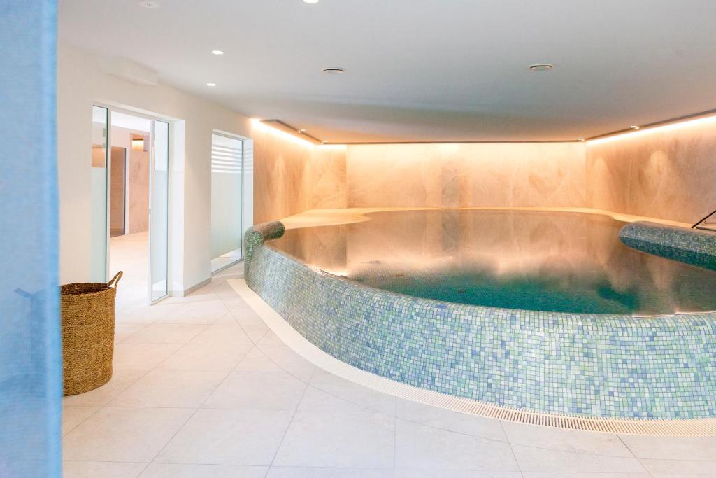 a jacuzzi tub in the lobby of a hotel at FischerS in Kassel