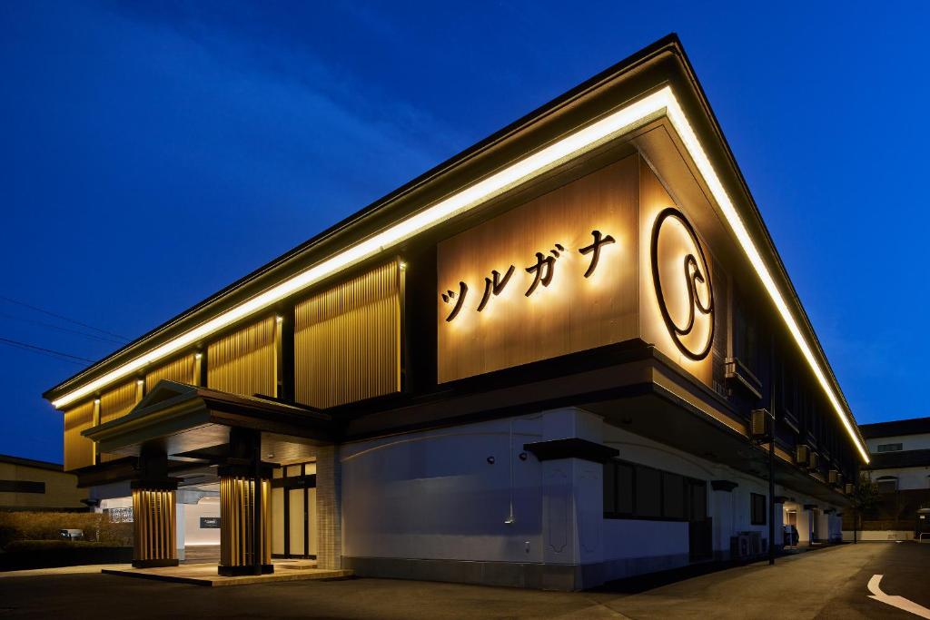 a building with a clock on the side of it at ツルガナホテル-レジャーホテル-ラブホテル in Sendai