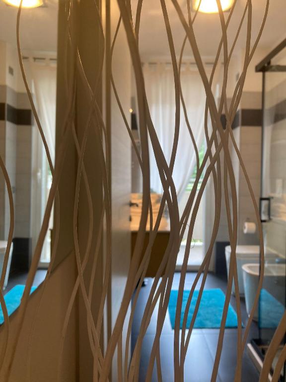 Postel nebo postele na pokoji v ubytování Bloom Apartment