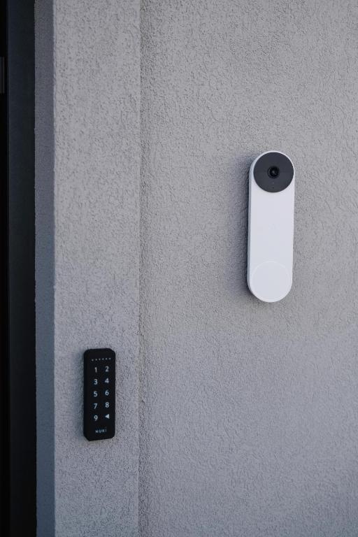 a remote control on a wall next to a wall at Aldoar House in Porto