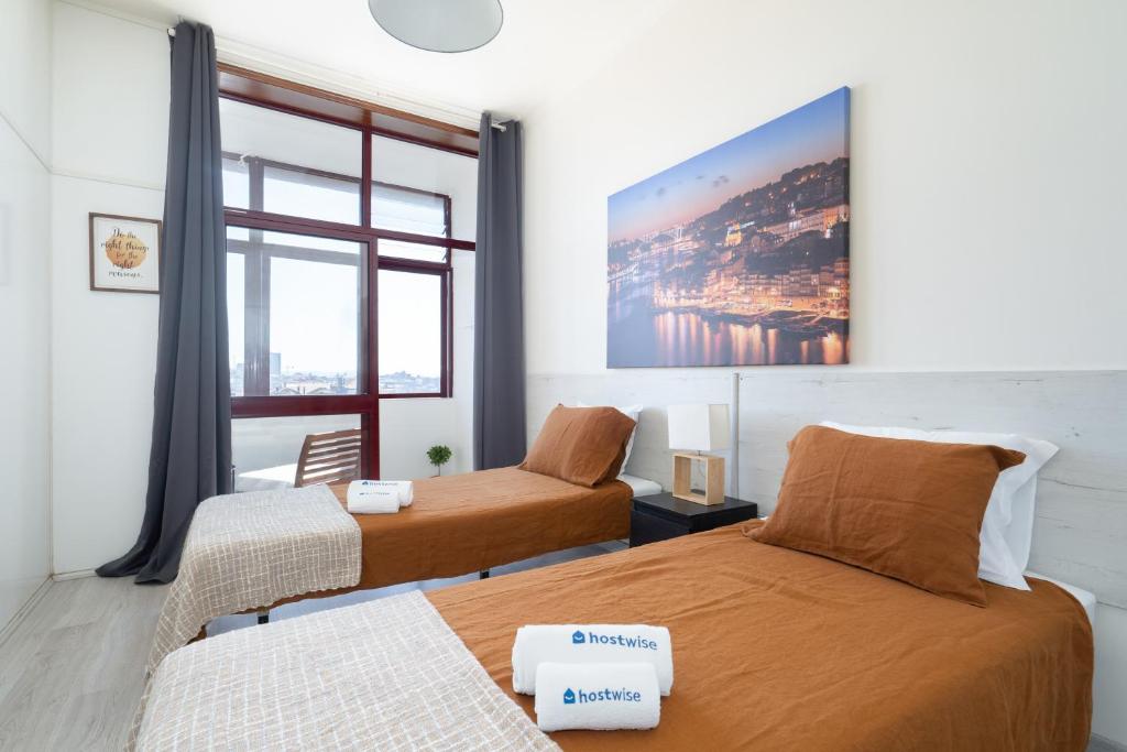 Katil atau katil-katil dalam bilik di Host Wise - Cozy Sunny Flats - Ace Location