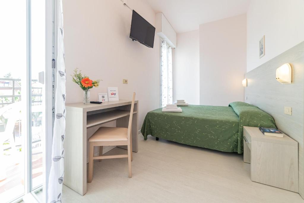 Postel nebo postele na pokoji v ubytování Hotel Royal