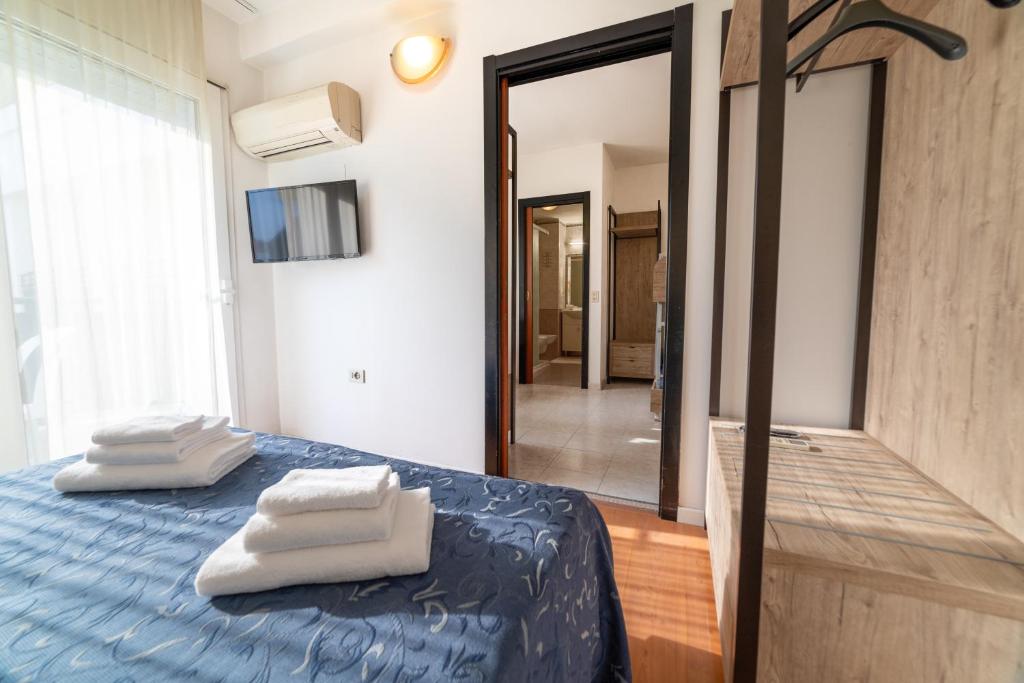 Postel nebo postele na pokoji v ubytování Hotel Royal