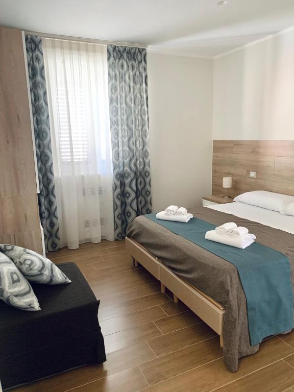 Postel nebo postele na pokoji v ubytování Tempio Aurora